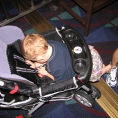 Evan slipping out of his stroller