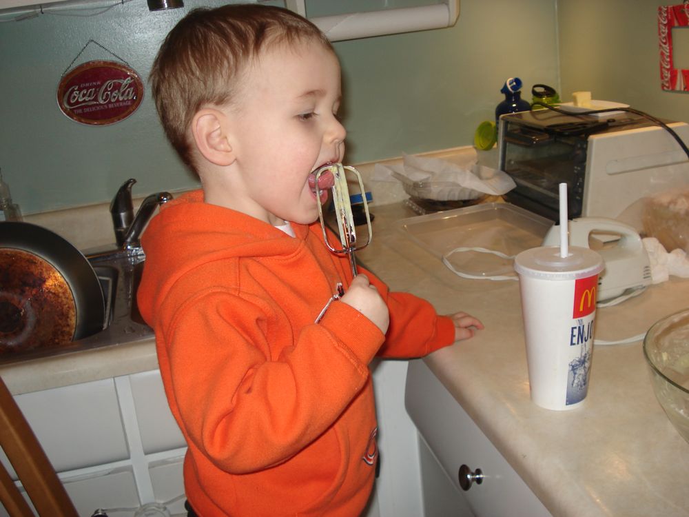 Evan helping Amy in the kitchen