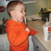 Evan helping Amy in the kitchen