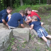 Evan in the sandbox with his cousins