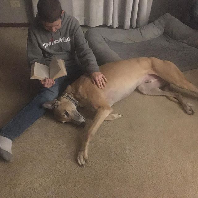 A boy, his dog, and a book...